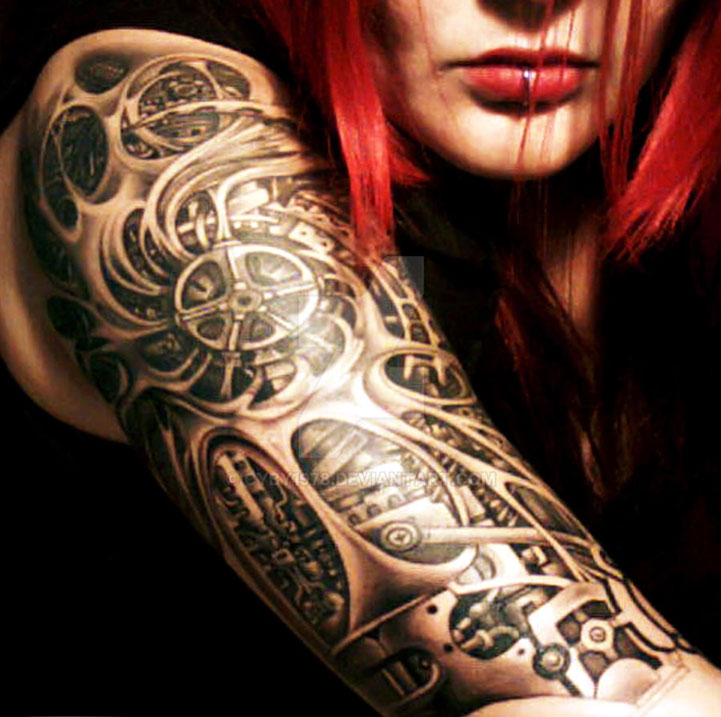 Woman with biomechanical shouldler tattoo