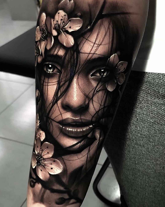Black and grey of woman on tattoo sleeve